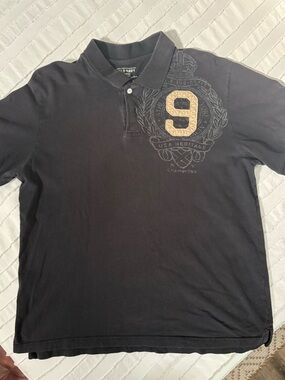 Old Navy Men's Black Polo with Gold '9' Crest